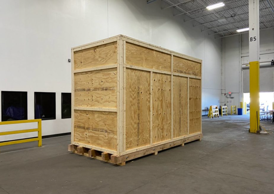 Large custom plywood shipping crate built by Bolstyn Packaging in a Burlington Ontario warehouse