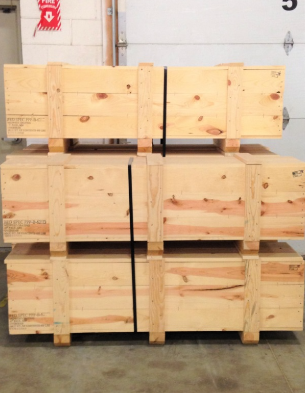 Two pallets wrapped in blue protective film side by side in the warehouse
